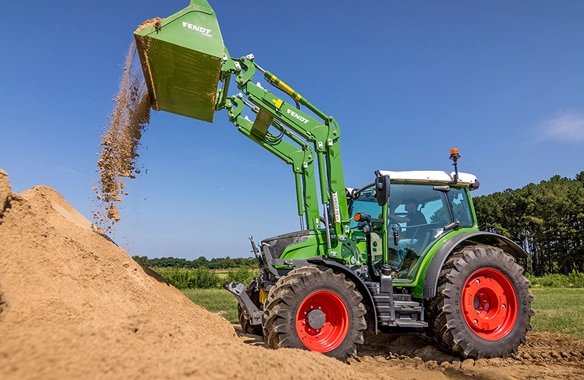 Fendt 200 Vario tractor using front loader to move soil on a construction site